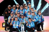 Adelaide Strikers celebrate with the WBBL trophy.