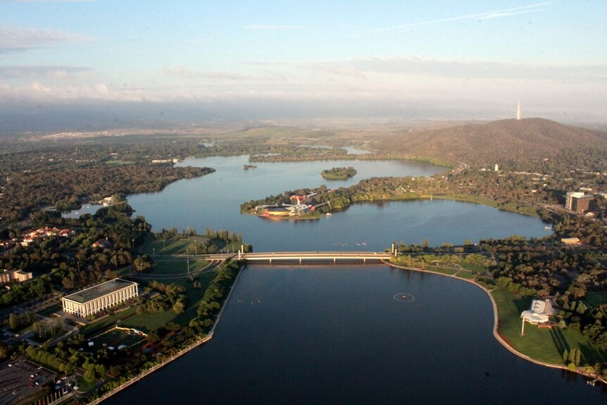 The view from a hot air balloon above Lake Burley Griffin, with the National Library of Australia to the left.