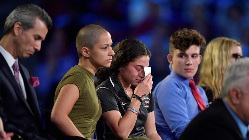 Emma consoles a peer during a panel discussion