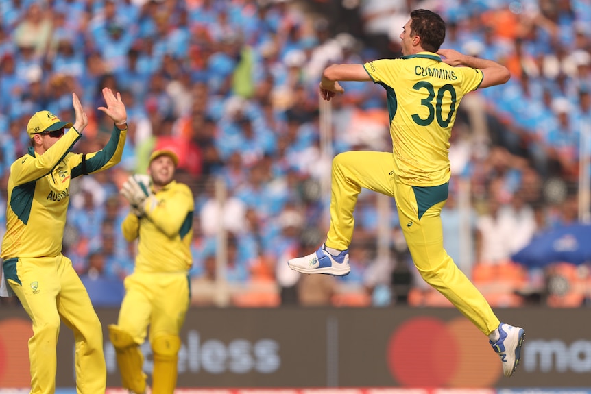 Australia cricket captain Pat Cummins leaps through the air.