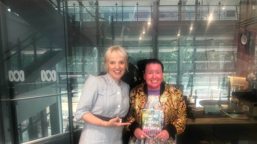 Jacinta Parsons and Carly Findlay at the ABC Southbank studios.  Carly is holding the book she edited.