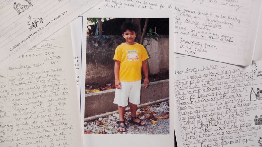 A photo of Timothy surrounded by his handwritten letters from George HW Bush.
