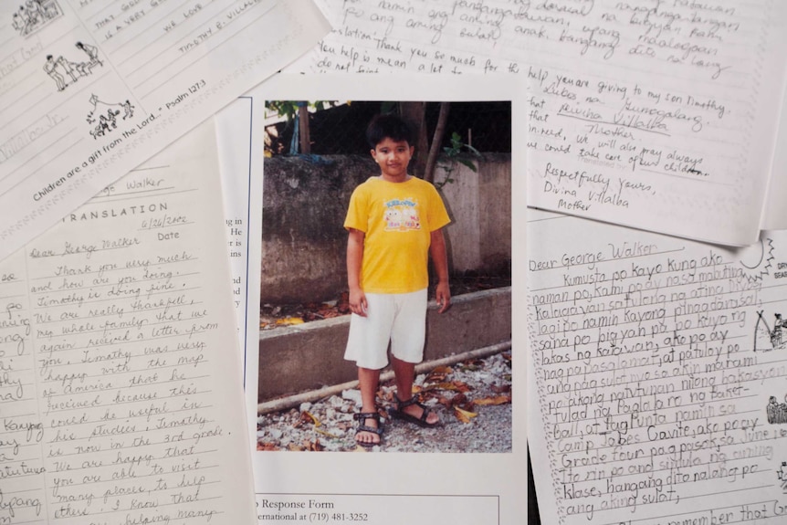 A photo of Timothy surrounded by his handwritten letters from George HW Bush.