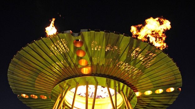 Cathy Freeman and Louise Sauvage re-light Sydney's Olympic cauldron