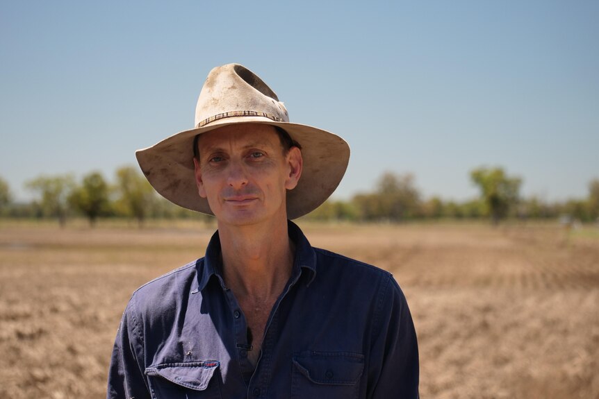 Texas farmer Adam Cleeve stands in a dead crop of barley