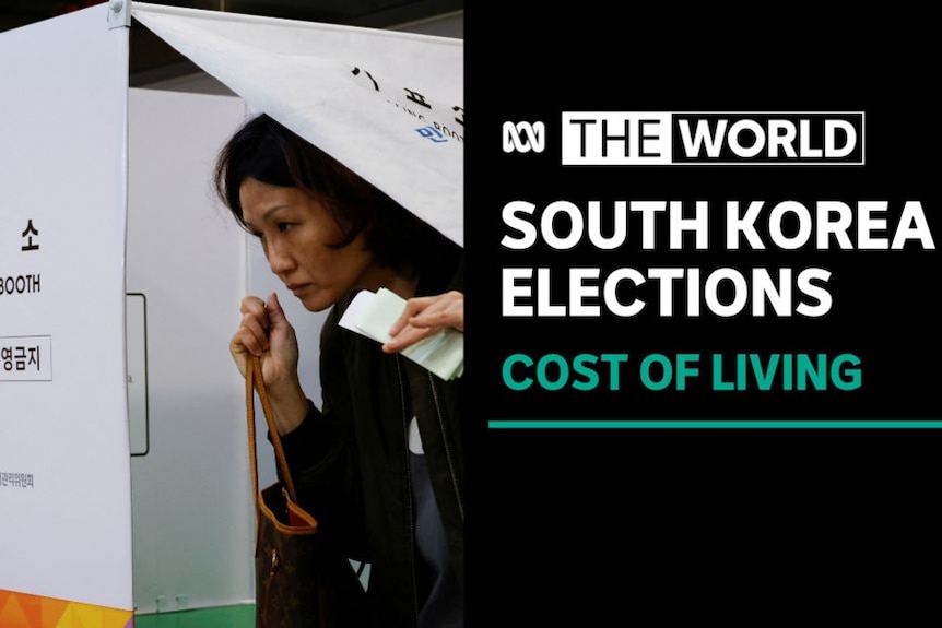 South Korea Elections, Cost of Living: A woman leaves a polling booth with Korean script on it.