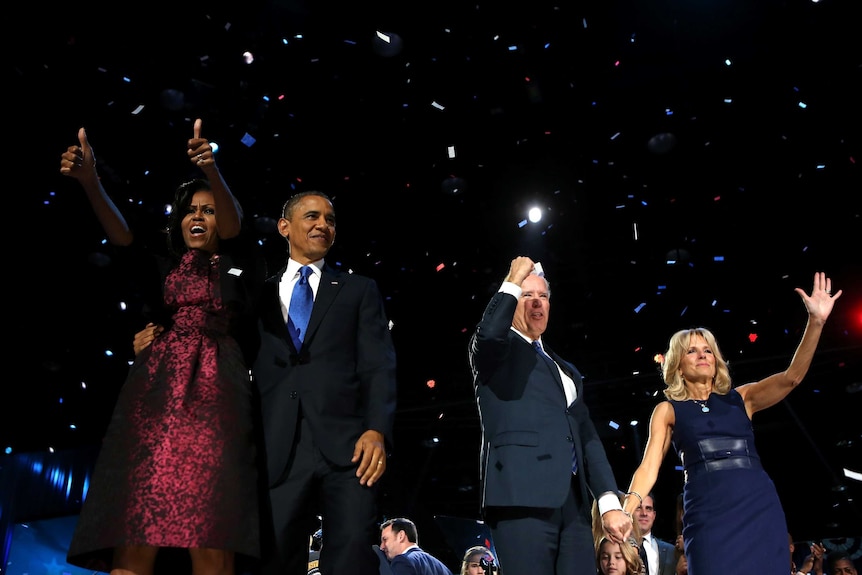 Barack Obama stands on stage with first lady Michelle Obama, US vice president Joe Biden and Dr Jill Biden after his victory.