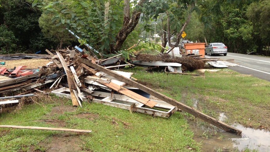 Sunshine Coast lashed ... debris litters a street in Pomona.