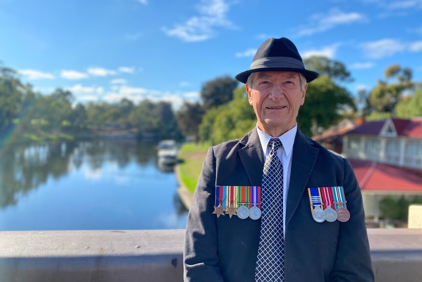 A veteran bedecked with service medals in Adelaide.