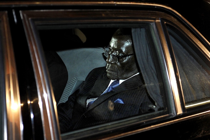 Robert Mugabe in the back of his car.