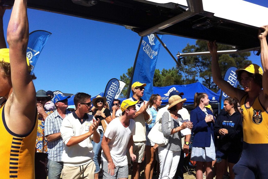 The crowd cheers on Scotch College rowers