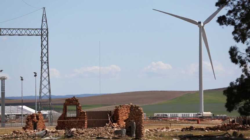 Building ruins with a windfarm turbine next to it