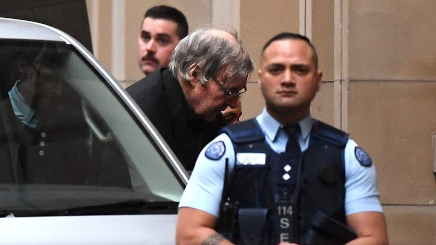 George Pell as he is escorted from a prison van into the Supreme Court of Victoria.