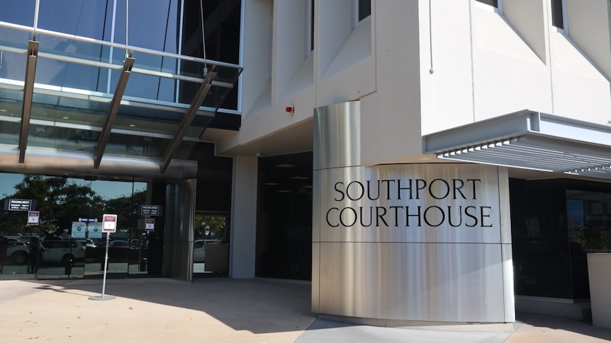 Front of courthouse, big silver bollard that reads "SOUTHPORT COURTHOUSE"