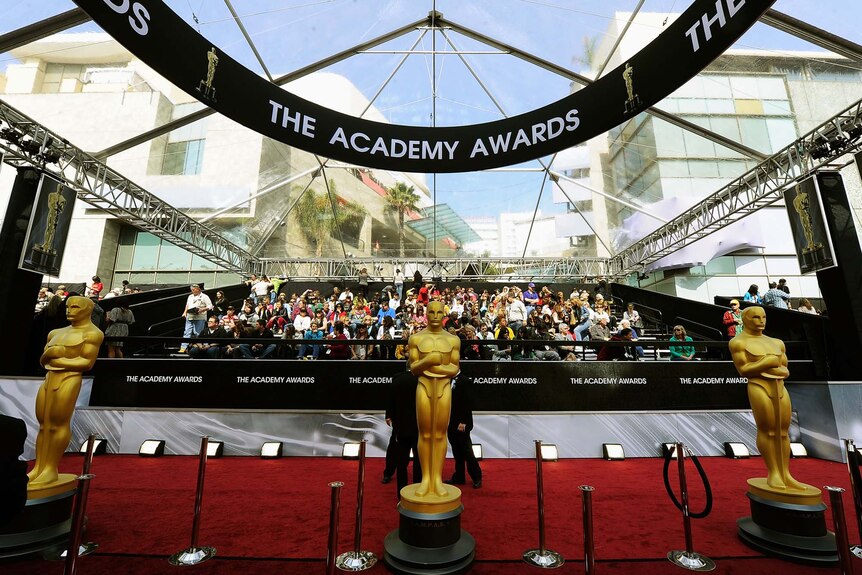 Oscar statues stand at the entrance of the 84th annual Academy Awards