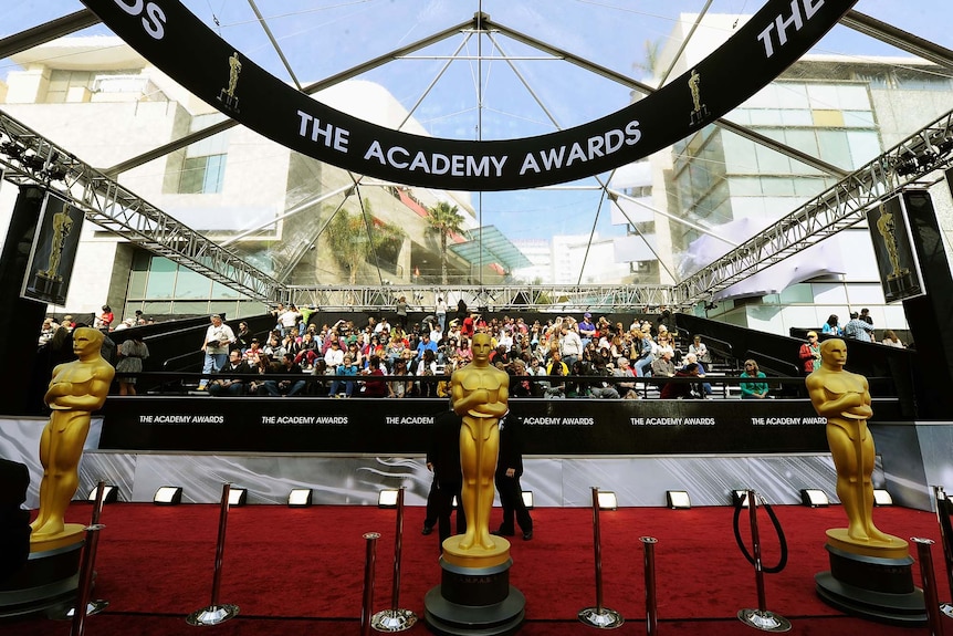 Oscar statues stand at the entrance of the 84th annual Academy Awards