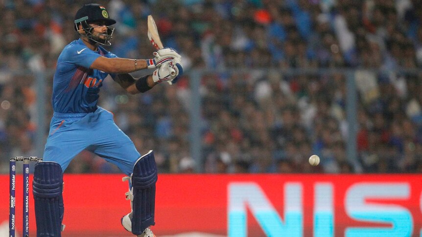 India's Virat Kohli plays a shot against Pakistan at World T20 match in Kolkata on March 19, 2016.
