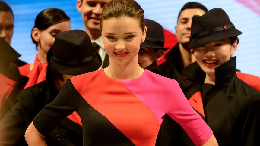 Miranda Kerr and Qantas staff model the new Qantas uniform.