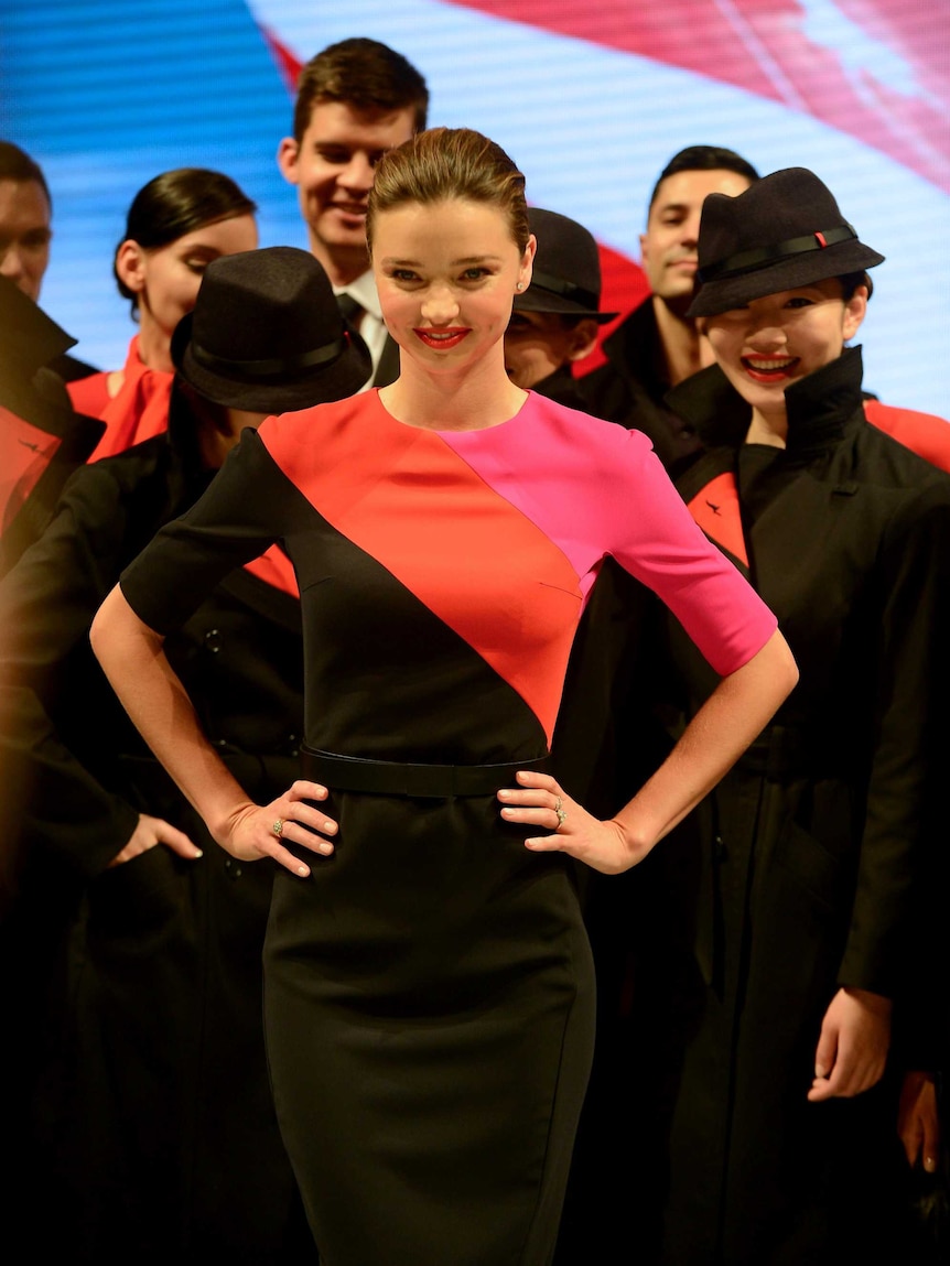 Miranda Kerr and Qantas staff model the new Qantas uniform.