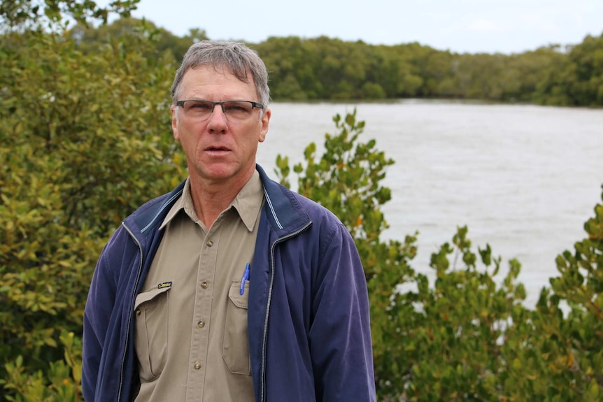 Redlands resident Chris Walker standing in front of water.