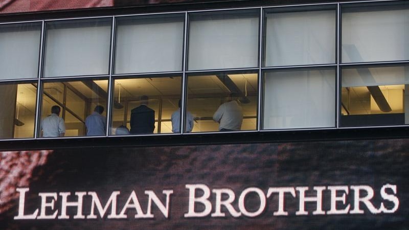 People sit in the window at the Lehman Brothers building in New York September 15, 2008.