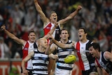 The Saints rejoice at the final siren as they celebrate around dejected Cats pair Gary Ablett and Joel Selwood