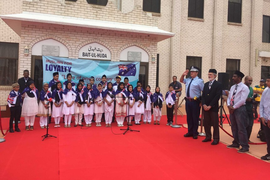 children from the Bait-ul-Huda mosque performed the national anthem outside mosque.