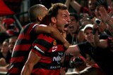 Brendon Santalab celebrates scoring the winner in the 87th minute against Sydney FC.