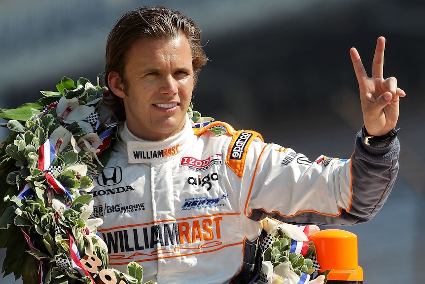 Indy driver Dan Wheldon gestures to photographers during the 95th Indianapolis 500 Mile Race Trophy Presentation.
