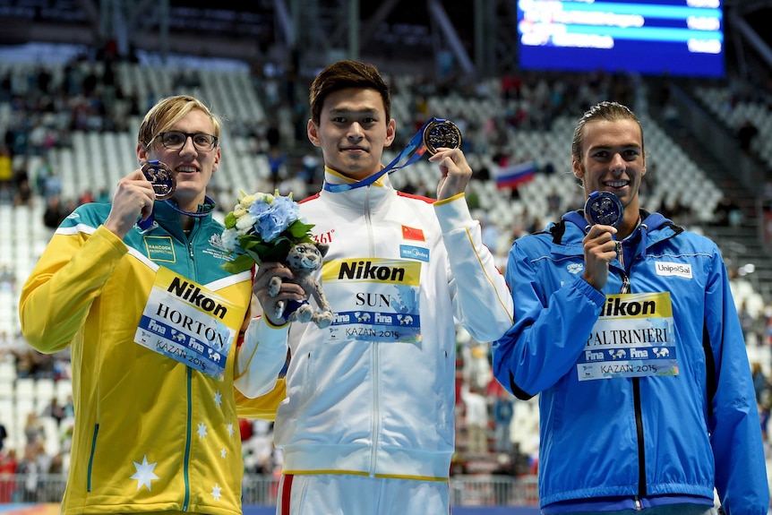 Mack Horton, Sun Yang and Gregorio Paltrinieri after the 800m freestyle at the swimming world championships