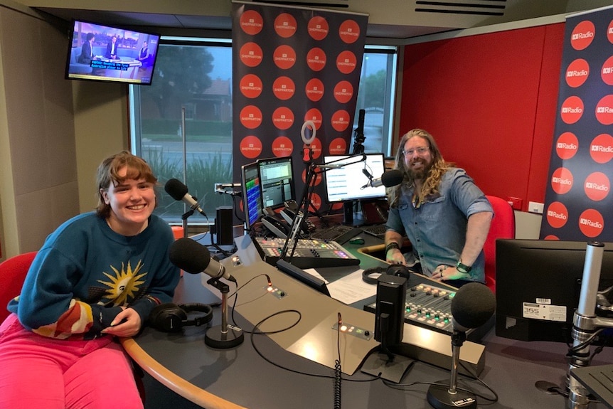 Woman and man in a radio studio.