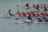 Dragon boat world championship competitors race towards the finish line at West Lakes.