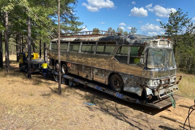 Old bus sits on trailer 