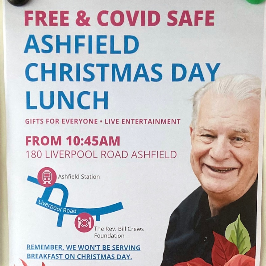 A poster on a wall advertising a free and safe Christmas day lunch in Ashfield Sydney.