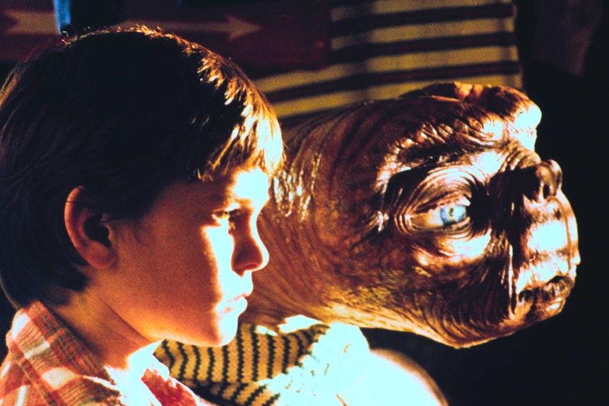 Elliott, played by Henry Thomas, looks out a window with the alien ET, in the 1982 Stephen Spielberg film.