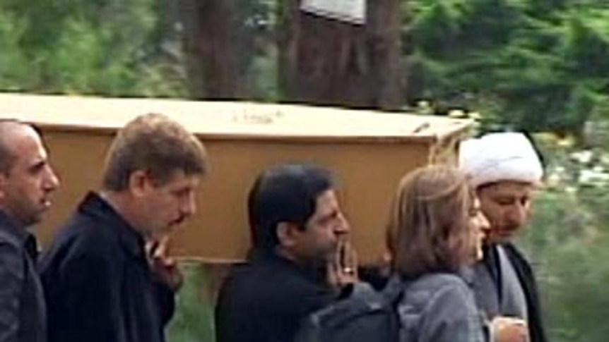 Pallbearers carry a coffin at a funeral for one of the Christmas Island boat tragedy victims