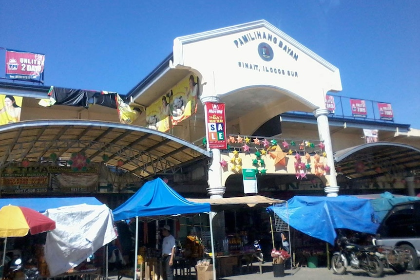 An exterior view from the street of a public market in Sinait