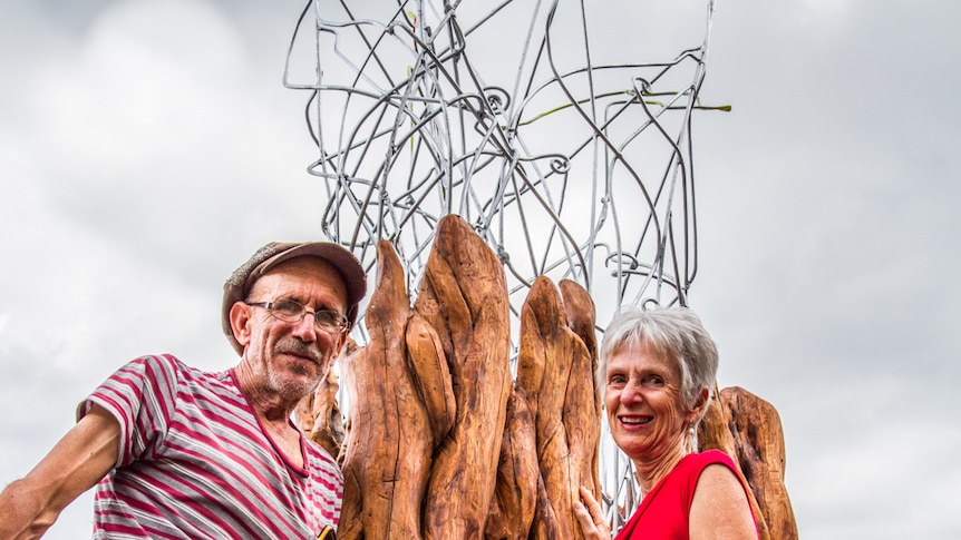 Artist Gabriele Trabucco and Helen Abrahams stand with the new sculpture