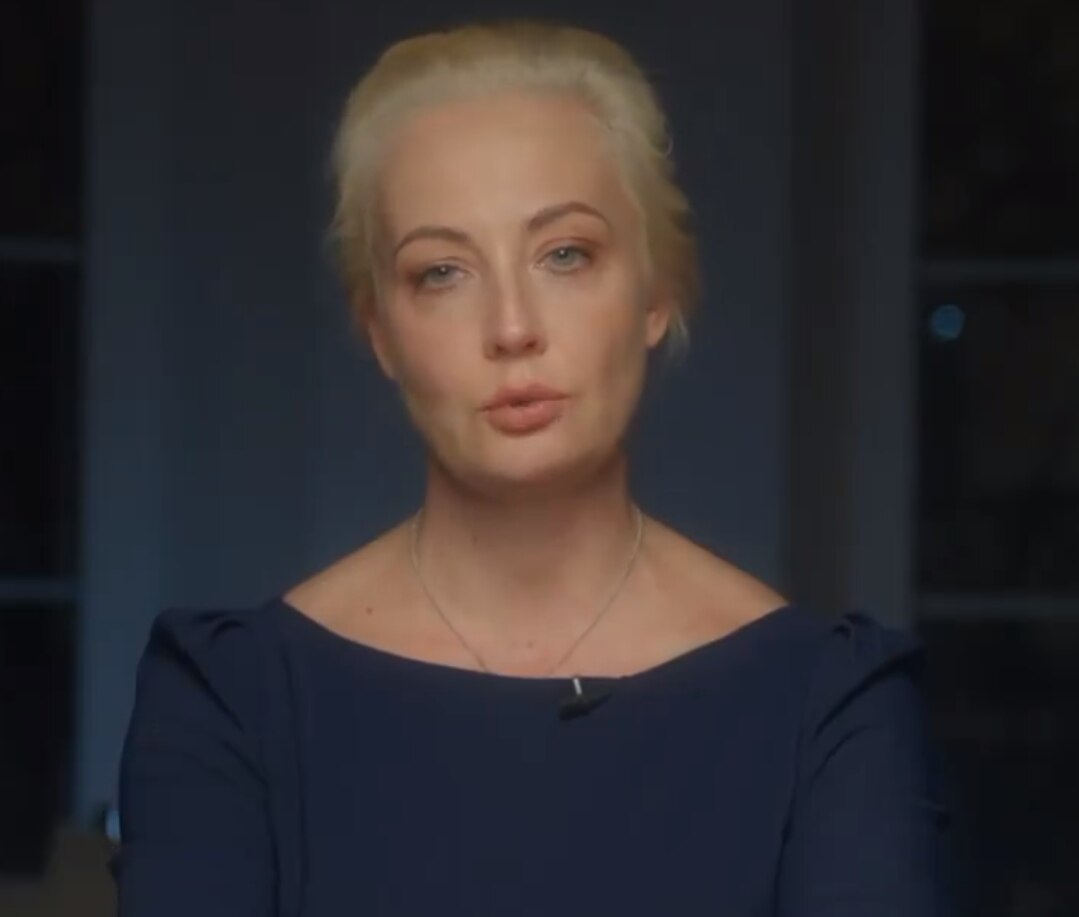 A woman with her in a bun.