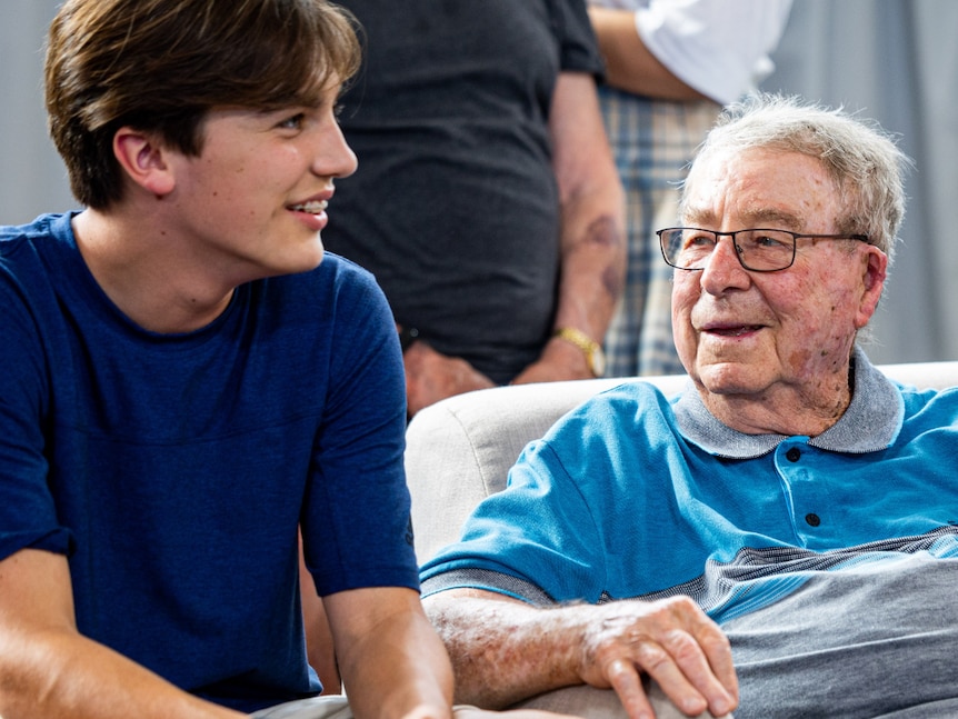 14-year-old Louis sits talking with 93-year-old Ken