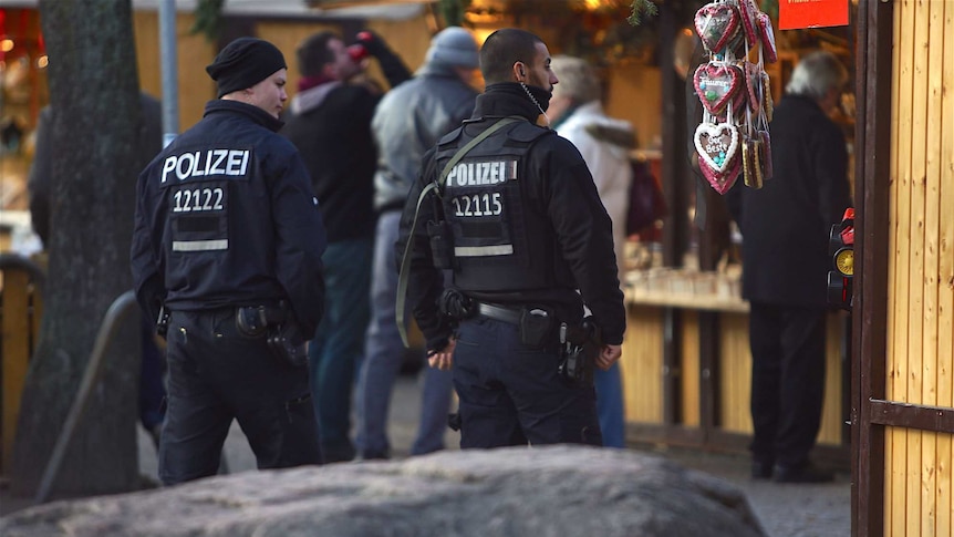 Armed police in a Christmas market.