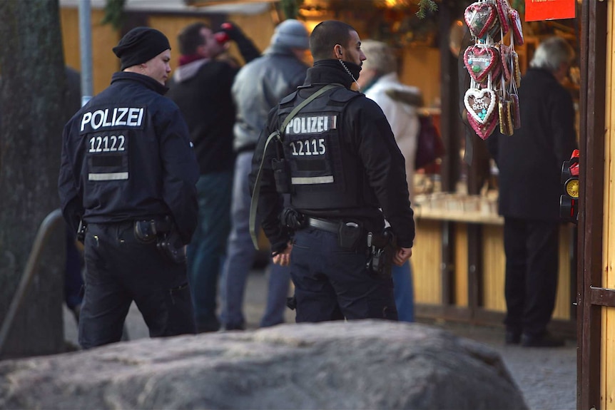 Armed police in a Christmas market.