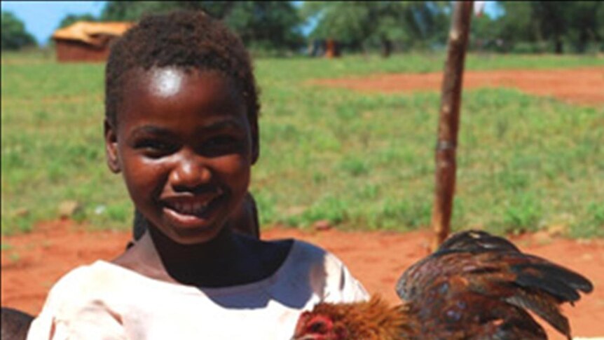 Mozambique children with chicken, Kyeema Foundation work