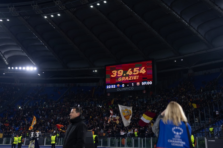 A stadium sign shows an attendance number during a women's game in Italy