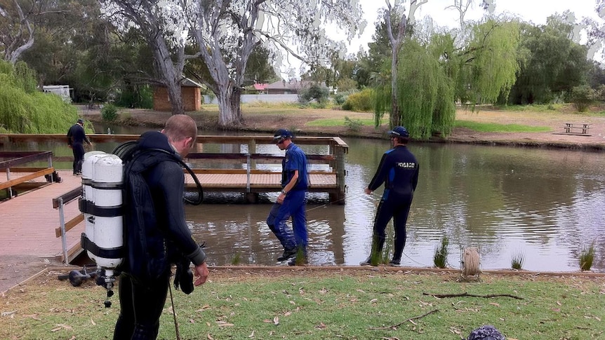 Water police have been searching at Kapunda for clues to help solve three brutal murders