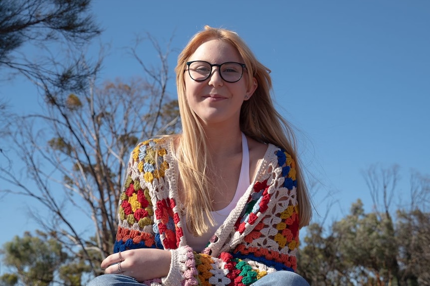 A young woman with long blonde hair.