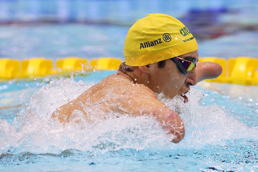 An Australian swimmer goes through the water while competing in a Para Sport swimming race.