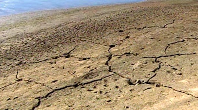 Sun dried earth next to a river