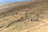 Sun dried earth next to a river