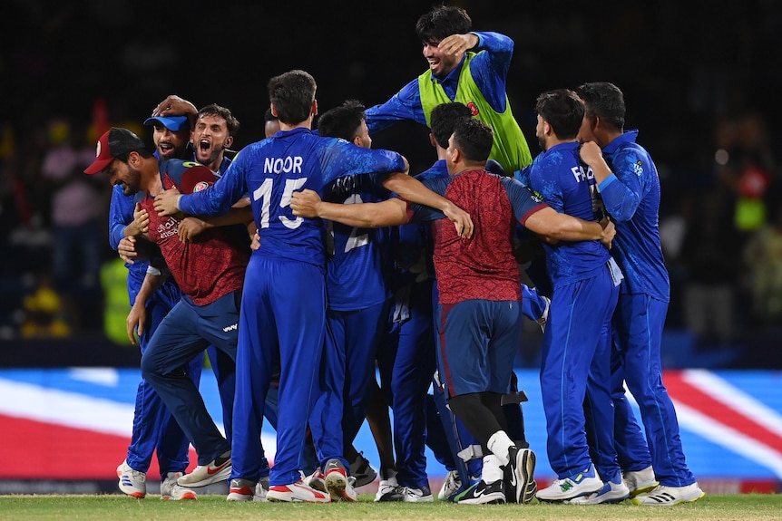 Afghanistan celebrates defeating Australia at the men's T20 World Cup.